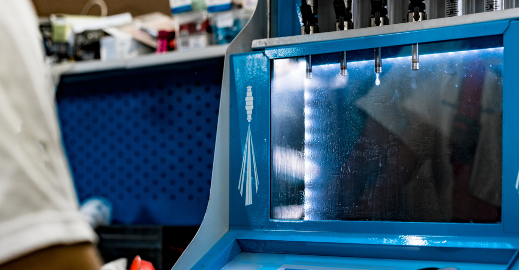 InjectorRX technician flow testing a set of restored fuel injectors